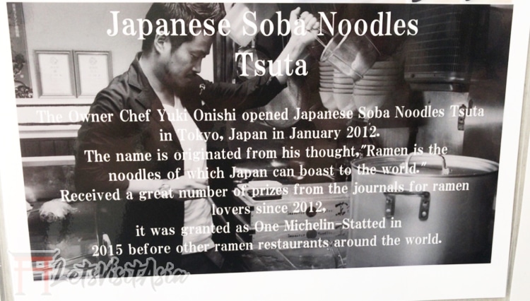 A small sign inside Tsuta Ramen in Tokyo explaining the backstory of the retaurant.