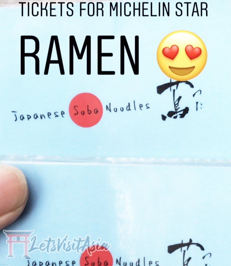 2 light blue tickets for Tsuta Ramen in Tokyo to signify a certain time slot