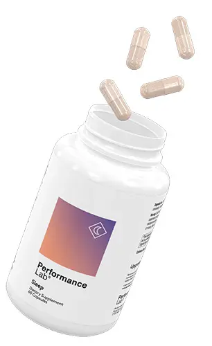 A bottle of Performance Lab Sleep with pills flying in the air